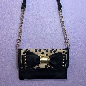 Betsey Johnson purse. Black and print animal, 9inches.